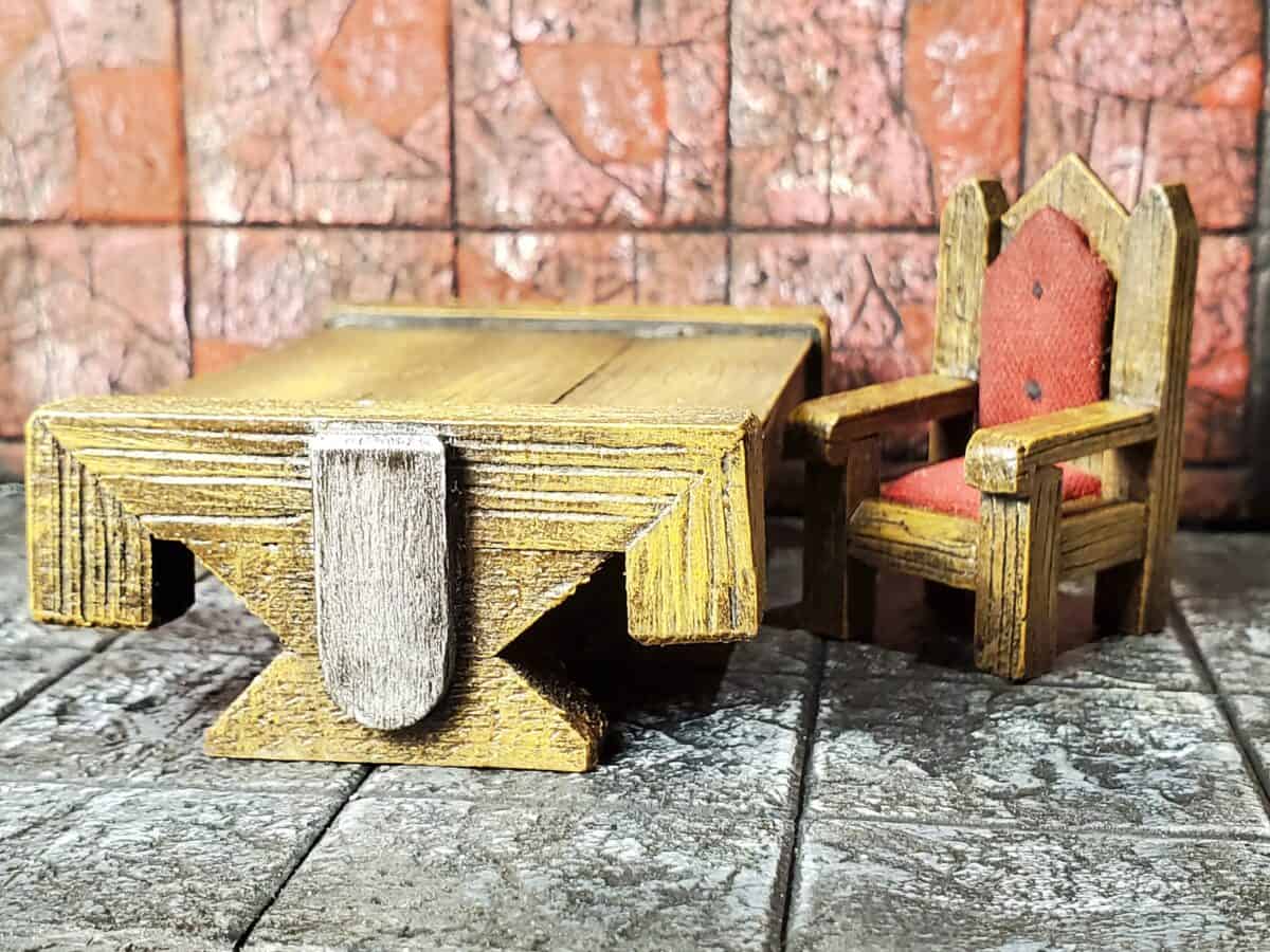 Crafted throne, sitting next to table.